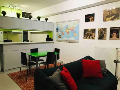a living room with a couch and a table at Acropolis Penthouse with 50mbps WIFI in Athens