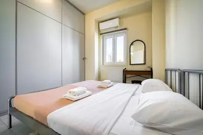 a bedroom with a large bed with towels on it at Acropolis Penthouse with 50mbps WIFI in Athens