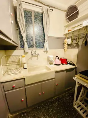 a kitchen with a sink and a window at Aegli of Acropolis - 50mbps wifi in Athens