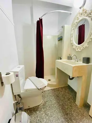 a bathroom with a toilet and a sink and a mirror at Aegli of Acropolis - 50mbps wifi in Athens