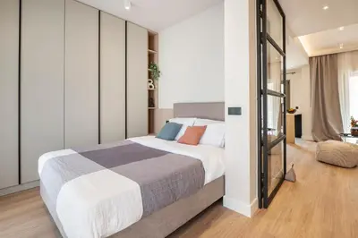 a bedroom with a large bed in a room at Lykavittos hill- penthouse in Athens