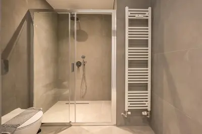 a bathroom with a shower with a toilet at Luxury Athens Living 3BR with Balcony in Athens