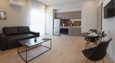 a living room with a black couch and a table at Athens city 2 bedrooms apartment A 100Mbps wifi in Athens