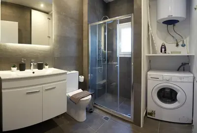 a bathroom with a sink and a washing machine at Athens city 2 bedrooms apartment A 100Mbps wifi in Athens