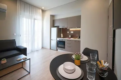 a living room with a dining table and a kitchen at Athens city 2 bedrooms apartment A 100Mbps wifi in Athens