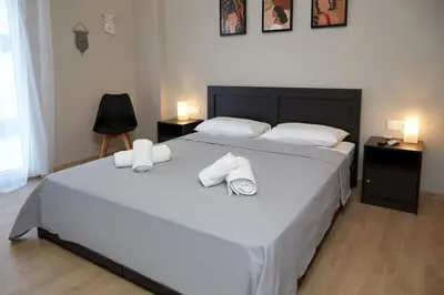 a bedroom with a large bed with towels on it at Athens city 2 bedrooms apartment A 100Mbps wifi in Athens