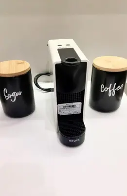 a toaster and two cups on a table at Beautiful apartment in Acropolis in Athens