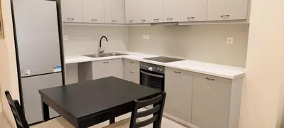 a small kitchen with a black table and a sink at Beautiful apartment in Acropolis in Athens