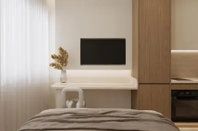 a bedroom with a television on a shelf with a chair at Luxury Living-Suite 1 in Athens