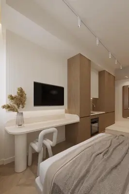 a bedroom with a desk with a tv on a wall at Luxury Living-Suite 1 in Athens