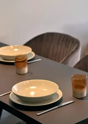 a table with two plates and two cups on it at Live in Athens City center flat in Athens