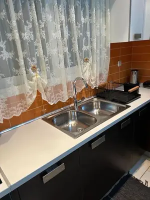 a kitchen sink in a kitchen with a window at Κεντρικό διαμέρισμα στην Αθηνα in Athens