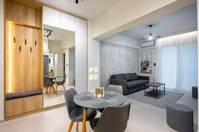 a living room with a table and a couch at Stylish Central Athens Apartment in Athens