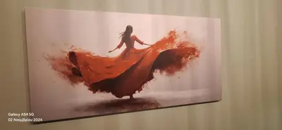 a painting of a woman in a dress on a wall at Homy in Athens
