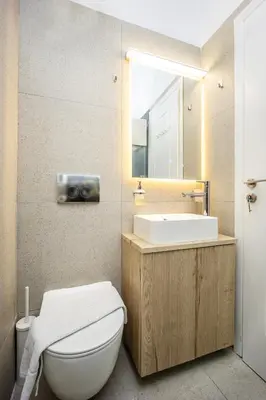a bathroom with a white toilet and a sink at DownTown Vibes 2 in Athens