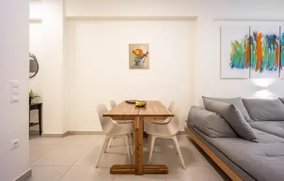 a living room with a table and a couch at DownTown vibes #1 in Athens