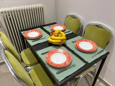a table with plates and a banana on it at VK apartment in Athens