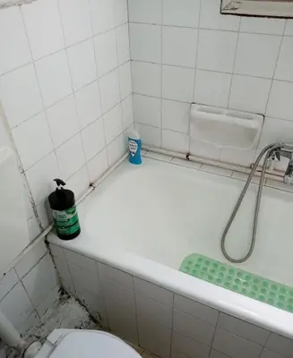 a bathroom with a bath tub and a toilet at Simple apartment in Athens