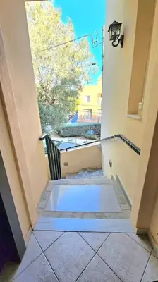 a view of a hallway of a building with a window at Διαμέρισμα στο Χαλάνδρι in Athens