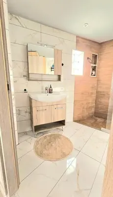 a bathroom with a sink and a shower at Διαμέρισμα στο Χαλάνδρι in Athens