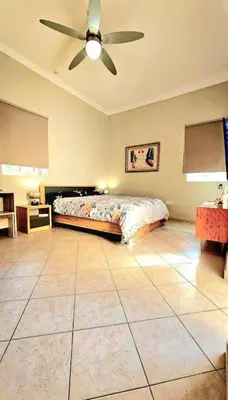 a bedroom with a bed and a ceiling fan at Διαμέρισμα στο Χαλάνδρι in Athens