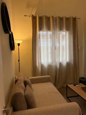 a bed in a room with a window at Cozy Attiki apartment by MPS in Athens