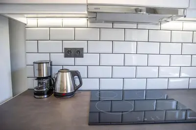 a coffeemaker sitting on a counter in a kitchen at The Athens Getaway Apartment in Athens