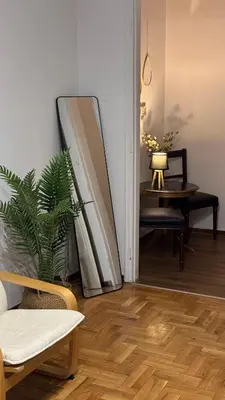 a living room with a mirror on the wall at Olēa House at Monastiraki in Athens