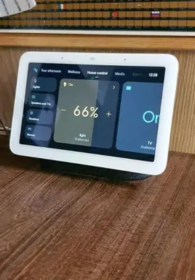 a tablet computer sitting on top of a wooden table at Έξυπνο στουντιο ημιυπόγειο στην Αθήνα με αυλή in Athens