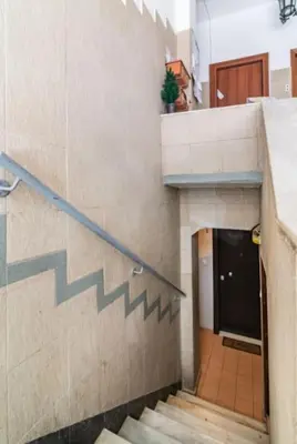 a staircase in a building with a stair case at Έξυπνο στουντιο ημιυπόγειο στην Αθήνα με αυλή in Athens