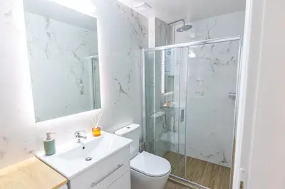 a bathroom with a shower and a toilet and a sink at Loft15Athens in Athens