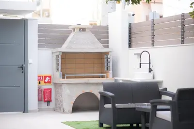 a model of a building with a table and chairs at Villa Redi Relaxing Spa in Piraeus