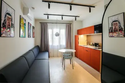 a living room with a couch and a table at Mooeve Psyri in Athens