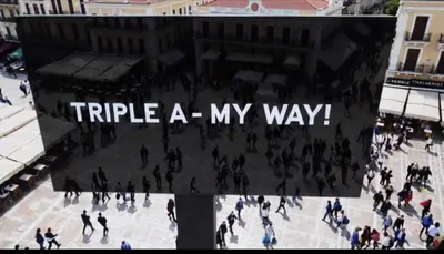 a group of people walking around a city at Triple A - Psiri Fruit Market Artistic Studios - FREE Parking in Athens