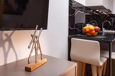 a pair of scissors sitting on top of a table at Synathens Syntagma Apartments in Athens