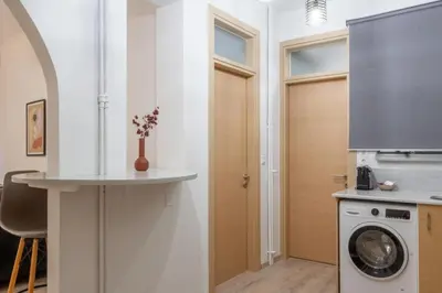 a kitchen with a washer and dryer in a room at Nobe Acropolis Suite in Athens