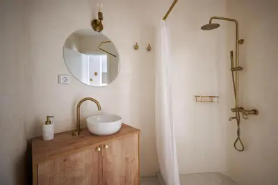 a bathroom with a sink and a mirror at BlueNote Suites in Athens