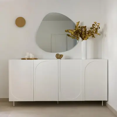 a white cabinet with a round mirror on top at BlueNote Suites in Athens
