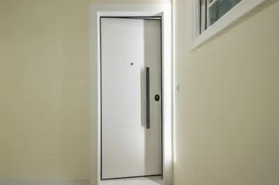 a sliding glass door in a white room at Exarcheia Luxury Apartment in Athens