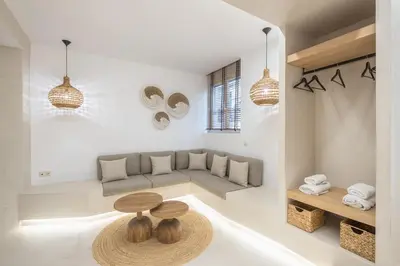 a living room with a couch and a table at Exarcheia Luxury Apartment in Athens