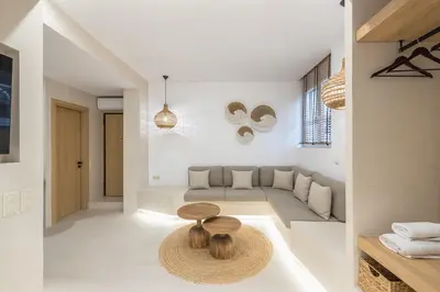 a living room with a couch and a table at Exarcheia Luxury Apartment in Athens