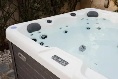 a jacuzzi bathtub in a garden with at Athenian Riviera Coastal Charm Villa in Athens