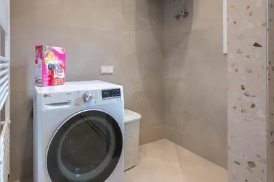 a washing machine with a box on top of it at Dream Athens Stay Cozy 3BR with balcony in Athens