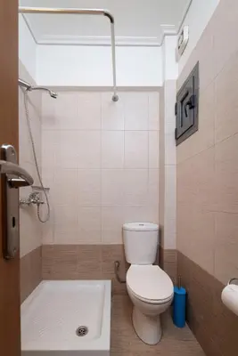 a bathroom with a toilet and a bath tub at 3BA next to metro and Athens city center with view in Athens