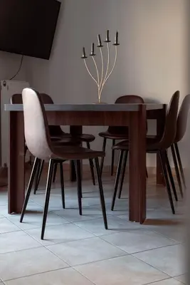a dining room table and chairs with a dining room table at 3BA next to metro and Athens city center with view in Athens