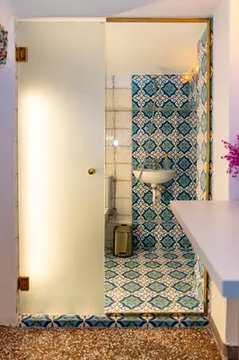 a bathroom with a toilet and a sink in a room at 1001 Nights - Low Celling Studio in downtown in Athens