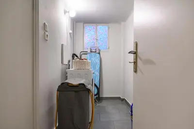 a hallway with a room with a door and a suitcase at Stunning Acropolis 2 bedroom Opulence in Athens