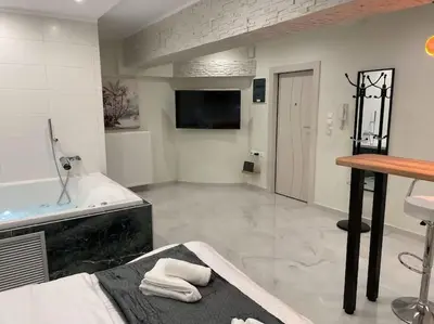 a large bathroom with a tub and a sink at Oasis of Ralaxation in Athens in Athens