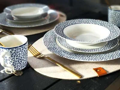a table with plates and a cup and a fork at Glyfada center seaview B in Athens