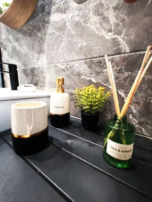 two bottles of soap and chopsticks on a counter at Glyfada center seaview B in Athens